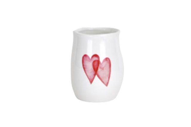 White ceramic vase with two hearts